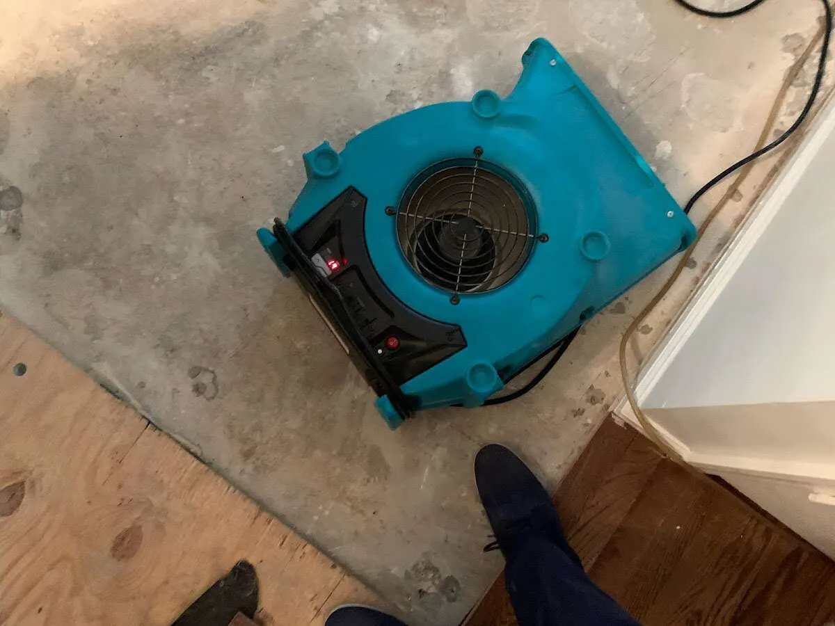 Air mover drying subfloor during Leak Detection & Repair in Marietta